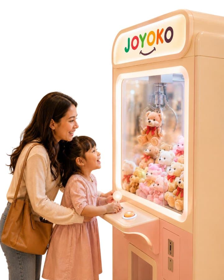 Mother and daughter playing a Joyoko claw machine